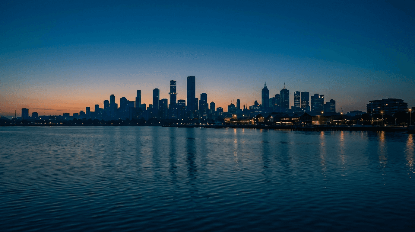 Sydney skyline at dusk reflecting city lights on the harbor